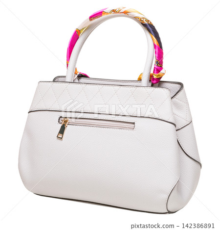 White leather womens handbag with colorful silk scarf on handle isolated on white background. Elegant quilted purse White leather womens handbag with colorful silk scarf on handle isolated on white background. Elegant quilted purse 142386891