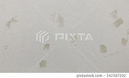 Full frame background texture of white painted wall with adhesive tape residue marks Full frame background texture of white painted wall with adhesive tape residue marks 142387202