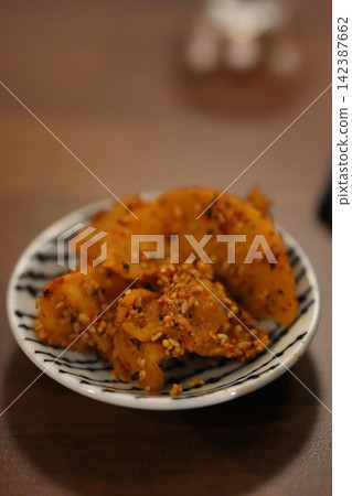 Sesame-Topped Spicy Potato Chips in Ceramic Bowl Sesame-Topped Spicy Potato Chips in Ceramic Bowl 142387662