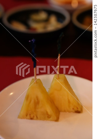 Pineapple Skewers on White Plate Pineapple Skewers on White Plate 142387675