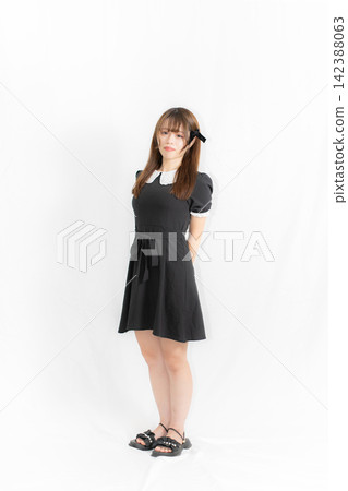 Summer outfit: Girl in a black dress Summer outfit: Girl in a black dress 142388063