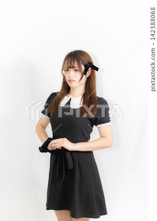 Summer outfit: Girl in a black dress Summer outfit: Girl in a black dress 142388068