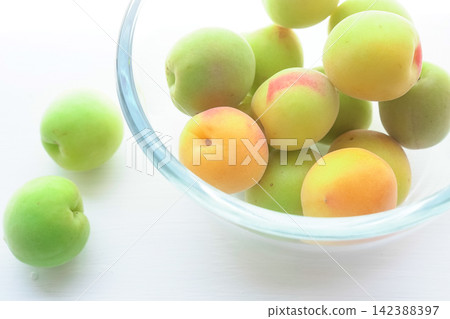 Plums in a glass container Plums in a glass container 142388397