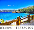 [Ogasawara Islands, Chichijima] March - The wooden deck at Miyanohama Park and the crystal-clear Bonin Blue sea. 142389405
