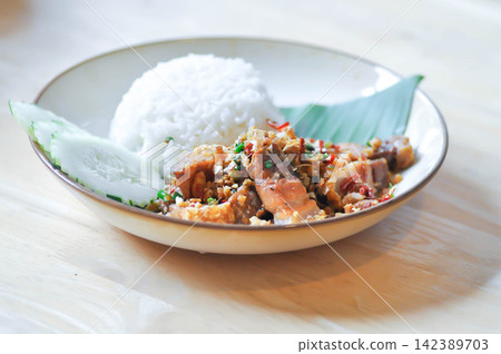stir fried pork or deep fried pork , fried pork or crispy pork and rice or belly of pork stir fried pork or deep fried pork , fried pork or crispy pork and rice or belly of pork 142389703
