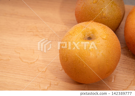 Pear with water droplets on it Pear with water droplets on it 142389777