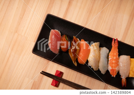 Nigiri sushi served on a black plate Nigiri sushi served on a black plate 142389804
