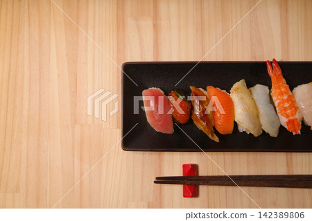 Nigiri sushi served on a black plate Nigiri sushi served on a black plate 142389806