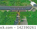 Aerial view of the dam embankment and reservoir. 142390261