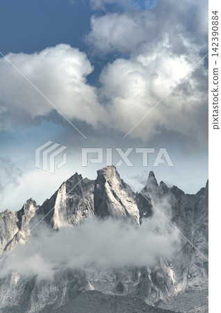 Mountains in the clouds on the Swiss Alps Mountains in the clouds on the Swiss Alps 142390884