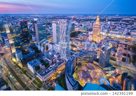 Elevated Warsaw Palace of Culture landmark skyline at blue hour in Poland Elevated Warsaw Palace of Culture landmark skyline at blue hour in Poland 142391199