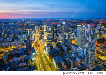 Bright Warsaw skyline skyscrapers at blue hour twilight in Poland 142391201