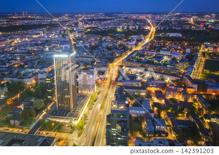 Dense Warsaw skyline skyscrapers at blue hour twilight in Poland Dense Warsaw skyline skyscrapers at blue hour twilight in Poland 142391203