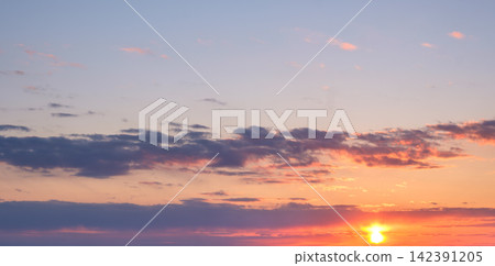 Dramatic sunset sky with vibrant colors and cloud formations at dusk Dramatic sunset sky with vibrant colors and cloud formations at dusk 142391205