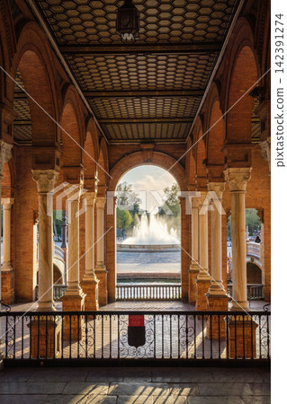 View of the central fountain through arches at Plaza de Espana View of the central fountain through arches at Plaza de Espana 142391274