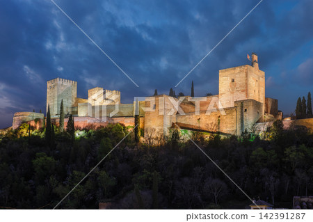 Illuminated Alcazaba of the Alhambra at twilight in Granada Illuminated Alcazaba of the Alhambra at twilight in Granada 142391287