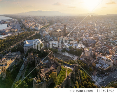Aerial view of Malaga cityscape at sunset with the Alcazaba Aerial view of Malaga cityscape at sunset with the Alcazaba 142391292