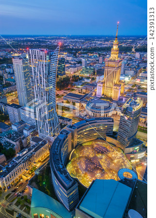 Dense Warsaw Palace of Culture landmark skyline at blue hour in Poland Dense Warsaw Palace of Culture landmark skyline at blue hour in Poland 142391313