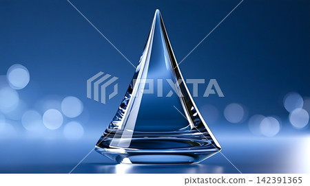 Glass pyramid award symbolizing success and achievement on blue background Glass pyramid award symbolizing success and achievement on blue background 142391365