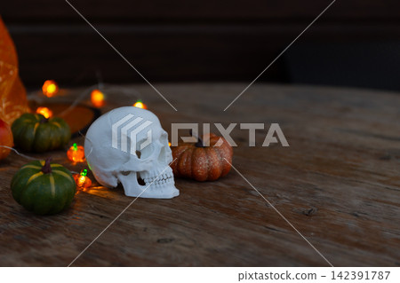 Halloween tabletop display: white skull with pumpkins and large copy space for ads Halloween tabletop display: white skull with pumpkins and large copy space for ads 142391787