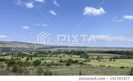 Green countryside landscape with blue sky Green countryside landscape with blue sky 142391927