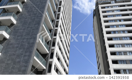 Modern apartment buildings against blue sky Modern apartment buildings against blue sky 142391938