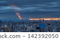 A panoramic view of Tokyo enveloped in thick clouds and the sunset. 142392050