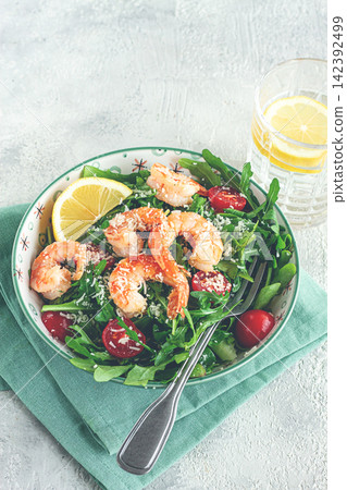 Shrimp salad with arugula and cherry tomatoes, with parmesan cheese, healthy food, 142392499