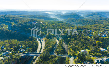 Aerial photograph of mist in the valley near the town of Woodford 142392502