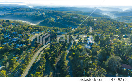Aerial photograph of mist in the valley near the town of Woodford Aerial photograph of mist in the valley near the town of Woodford 142392503