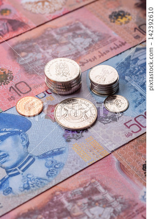 Brunei paper money, dollar banknotes and sen coins as currency for exchange or travel. Brunei money Brunei paper money, dollar banknotes and sen coins as currency for exchange or travel. Brunei money 142392610
