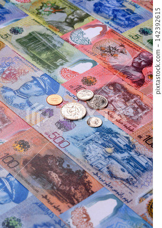 Brunei paper money, dollar banknotes and sen coins as currency for exchange or travel. Brunei money Brunei paper money, dollar banknotes and sen coins as currency for exchange or travel. Brunei money 142392615