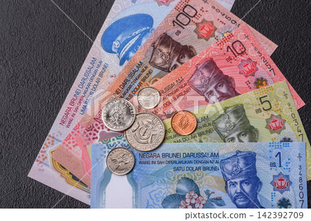 Brunei paper money, dollar banknotes and sen coins as currency for exchange or travel. Brunei money 142392709
