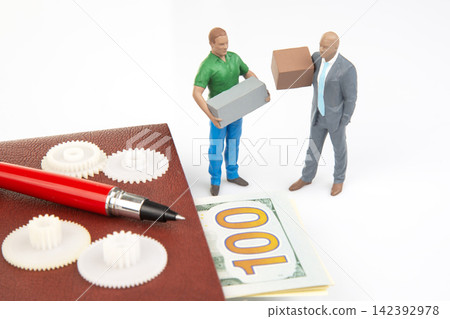 Miniature people work together with boxes and money on a surface Miniature people work together with boxes and money on a surface 142392978
