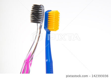 Different types of toothbrushes placed side by side for comparison Different types of toothbrushes placed side by side for comparison 142393036