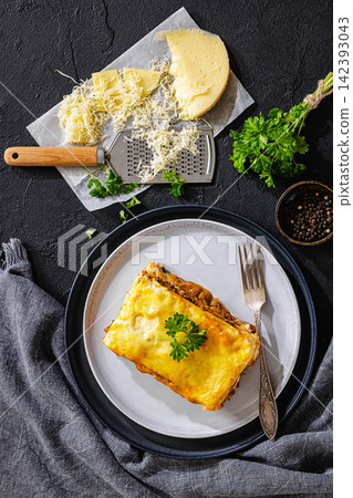 Baked lasagna square with beef, sauce, cheese Baked lasagna square with beef, sauce, cheese 142393043
