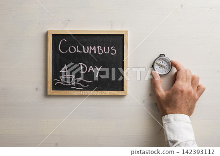Columbus day chalkboard with a compass Columbus day chalkboard with a compass 142393112