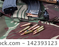 7.62mm Rifle Ammunition and Magazines on Military Camouflage Gear 142393123