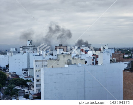 Cordoba, Argentina - April 8, 2026: Dark Smoke Rising From Urban Fire Over Cofico Cordoba, Argentina - April 8, 2026: Dark Smoke Rising From Urban Fire Over Cofico 142394375