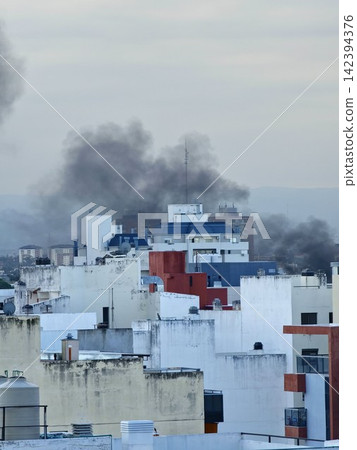 Cordoba, Argentina - April 8, 2026: Thick Black Smoke From City Fire in Cofico Cordoba, Argentina - April 8, 2026: Thick Black Smoke From City Fire in Cofico 142394376