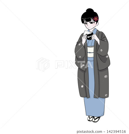 A woman in a kimono holding a cat-shaped hand warmer as a winter cold weather measure. A woman in a kimono holding a cat-shaped hand warmer as a winter cold weather measure. 142394516