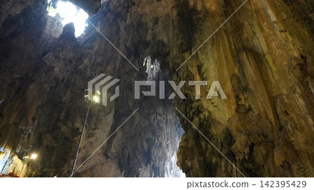 Cave Interior with Light and Rock Formations Cave Interior with Light and Rock Formations 142395429