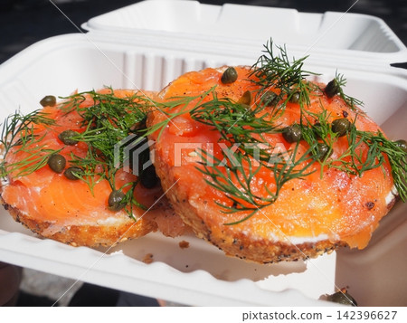 A New York specialty: Authentic Lux's bagel topped with smoked salmon, dill, and capers. A New York specialty: Authentic Lux's bagel topped with smoked salmon, dill, and capers. 142396627