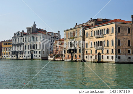 Historic palace buildings lining the Grand Canal in Venice, Italy Historic palace buildings lining the Grand Canal in Venice, Italy 142397319