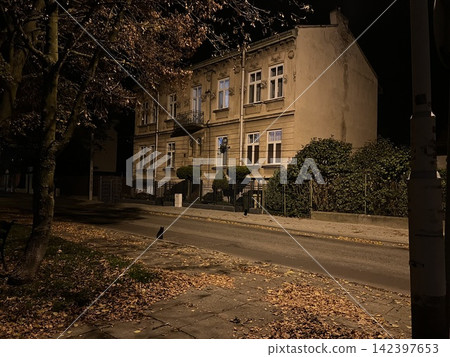 Old residential house at night on a quiet street in Przemysl Poland Old residential house at night on a quiet street in Przemysl Poland 142397653