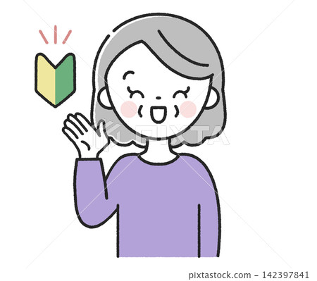 一位臉上帶著新手駕照標記、面帶微笑的老婦人正在指路。 一位臉上帶著新手駕照標記、面帶微笑的老婦人正在指路。 142397841
