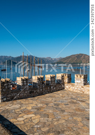 Medieval stone battlements overlooking sea bay in Marmaris Turkey Medieval stone battlements overlooking sea bay in Marmaris Turkey 142397958