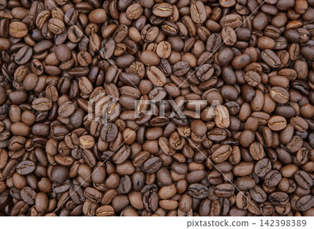 op view macro shot of freshly roasted brown coffee beans filling the frame. Ideal for cafe menu, packaging, and background design. op view macro shot of freshly roasted brown coffee beans filling the frame. Ideal for cafe menu, packaging, and background design. 142398389
