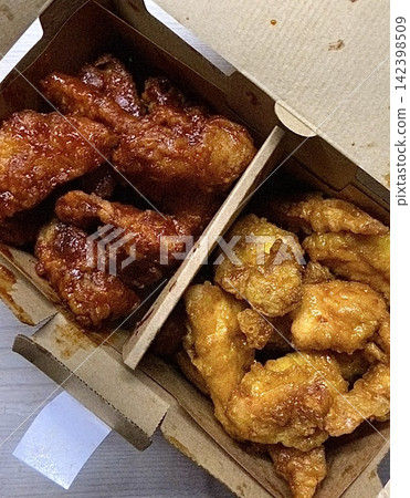 Crispy Korean fried chicken, perfectly glazed with a sweet and spicy sauce. Ideal for food photography and menus, showcasing the irresistible crunch and flavor of this beloved dish. Crispy Korean fried chicken, perfectly glazed with a sweet and spicy sauce. Ideal for food photography and menus, showcasing the irresistible crunch and flavor of this beloved dish. 142398509