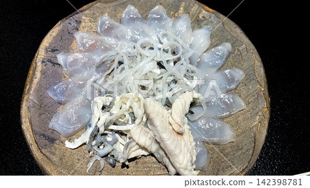 Beautifully presented fugu sashimi, a high-class Japanese dish. Beautifully presented fugu sashimi, a high-class Japanese dish. 142398781